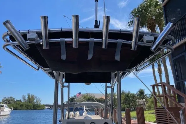 Slide: The Image of 2017 Key West 239 FS boat with rod holders, docked by a scenic waterway. - 4