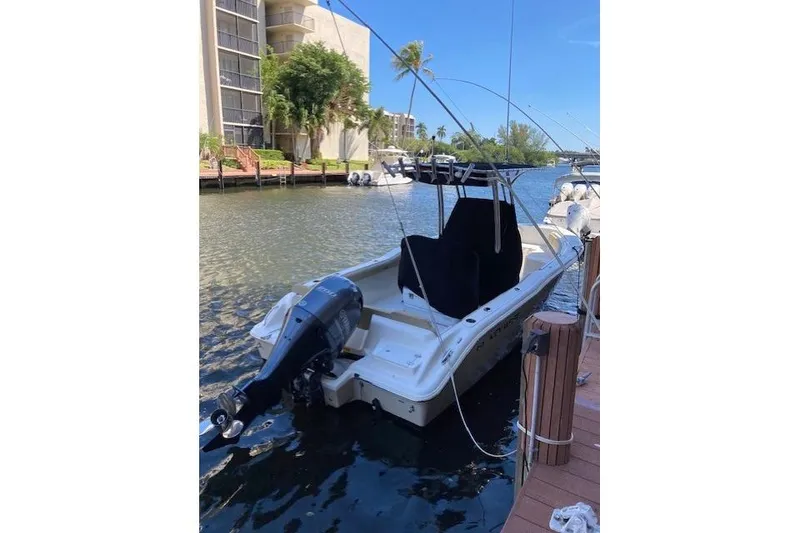 Slide: The Image of 2017 Key West 239 FS boat docked on a sunny waterfront. - 6