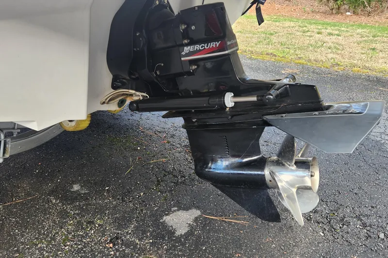 Slide: The Image of Outboard motor of a 2003 Sea Ray 225 Weekender on pavement. - 5
