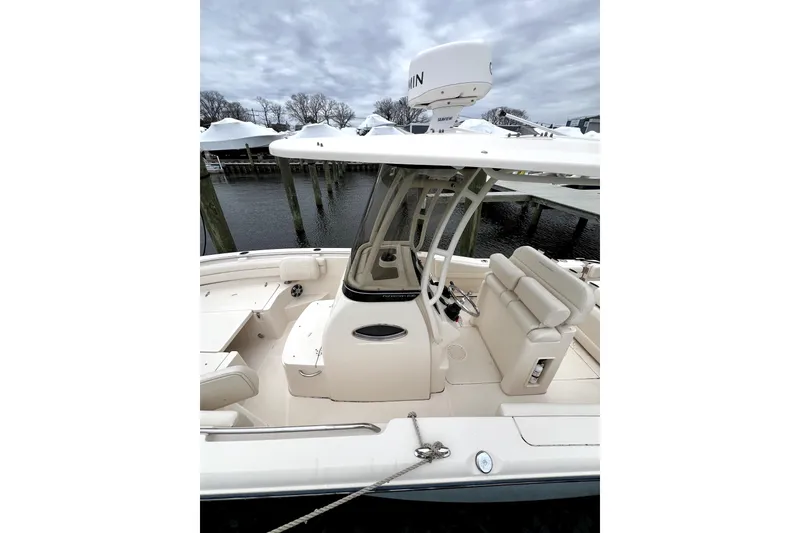 Slide: The Image of 2022 Grady-White Fisherman 236 boat interior with seating and navigation equipment. - 5