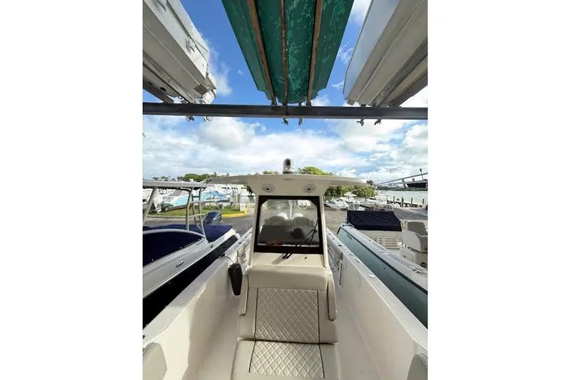 Slide: The Image of Coiled rope and mechanical components on a 2022 Pursuit S 268 Sport boat. - 21