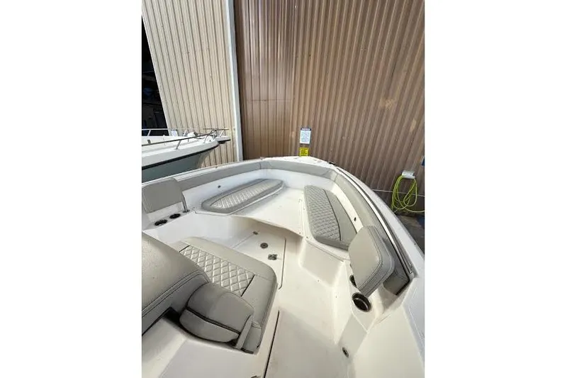 Slide: The Image of 2022 Pursuit S 268 Sport boat stern with dual propellers. - 22
