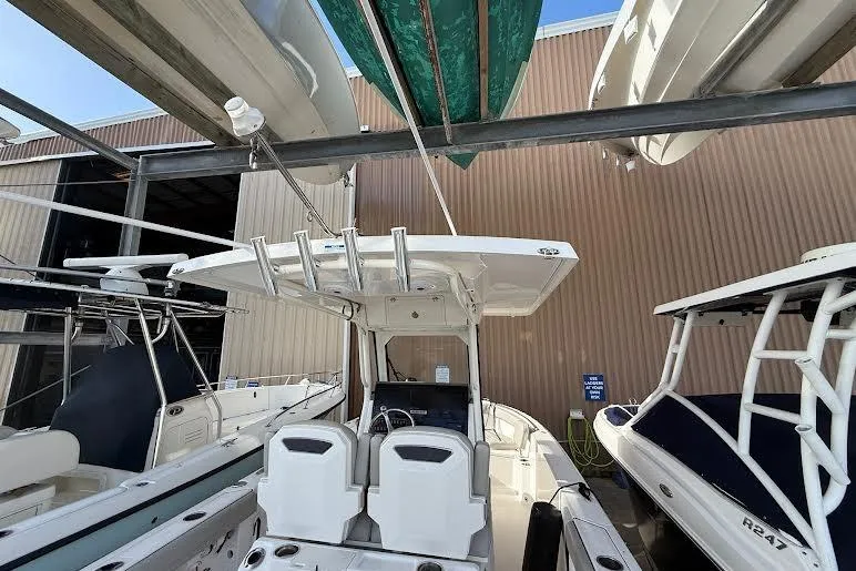 Slide: The Image of Twin outboard motors on a 2022 Pursuit S 268 Sport boat. - 23