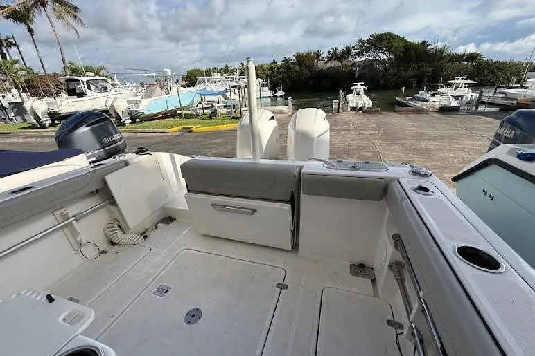 Slide: The Image of 2022 Pursuit S 268 Sport boat on trailer, showcasing bow and anchor detail. - 25