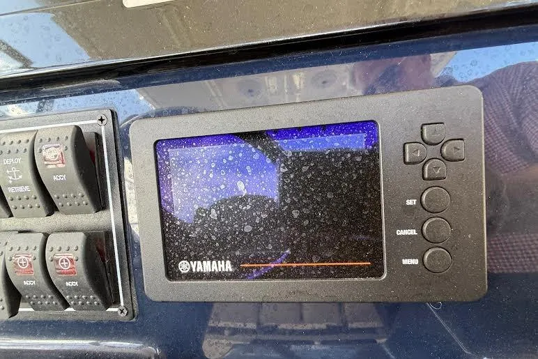 Slide: The Image of Twin Yamaha outboard motors on a 2022 Pursuit S 268 Sport boat. - 27