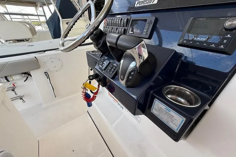 Slide: The Image of Manufacturer Provided Image: 2022 Pursuit S 268 Sport boat on water with two people onboard. - 29