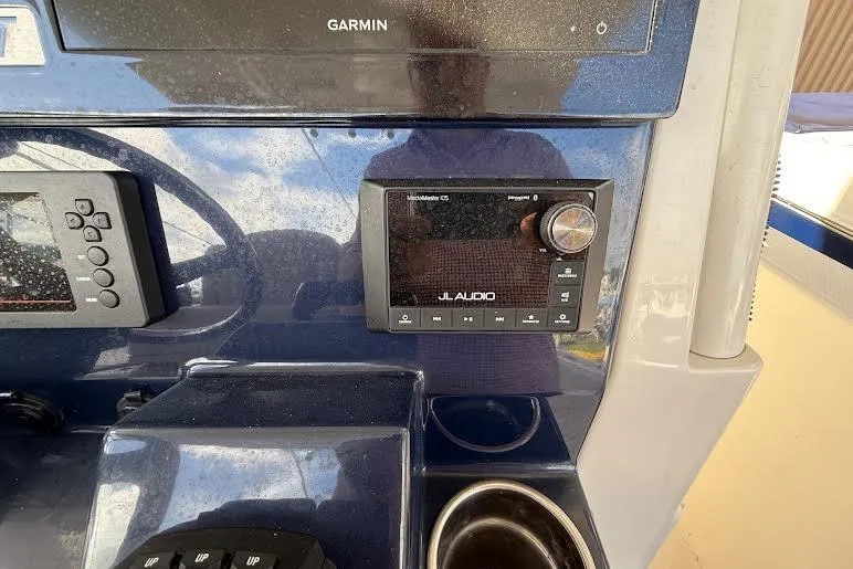 Slide: The Image of Manufacturer Provided Image: 2022 Pursuit S 268 Sport boat cruising on open water. - 31