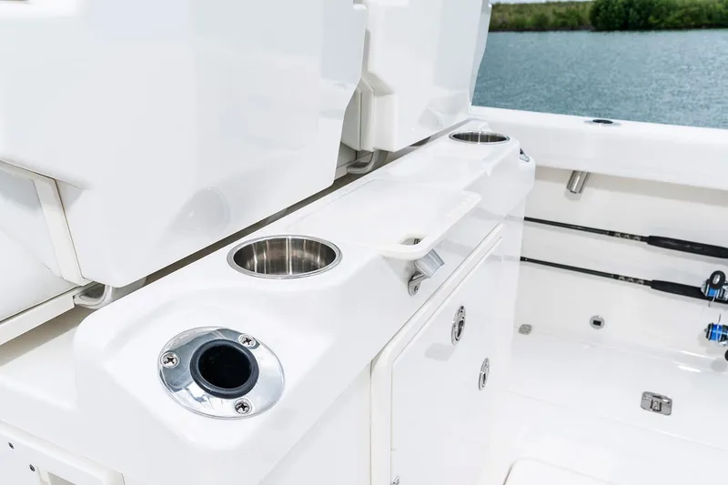 Slide: The Image of Manufacturer Provided Image: 2022 Pursuit S 268 Sport boat interior with cup holders and storage compartments. - 40