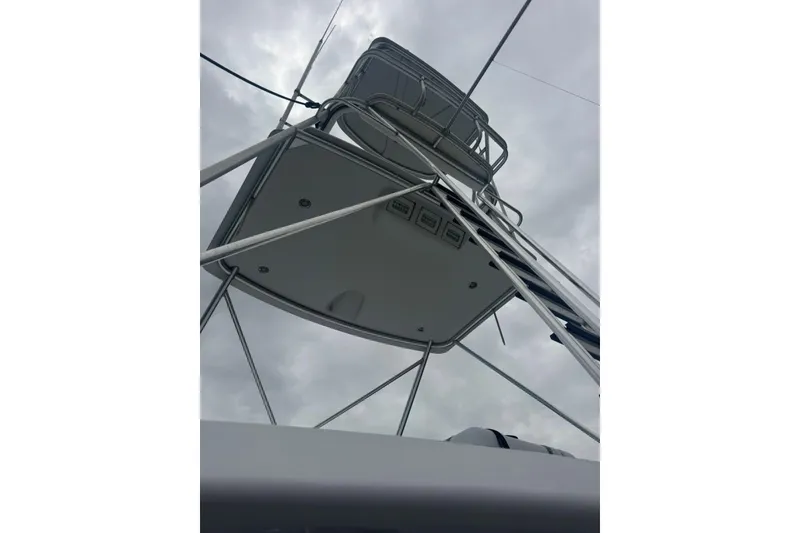 Slide: The Image of 2007 Hatteras boat tower with ladder against cloudy sky. - 11