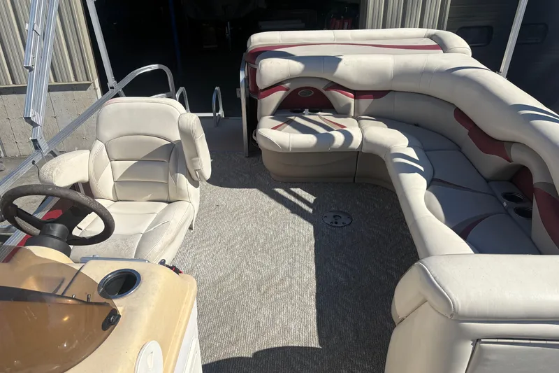 Slide: The Image of Interior of a 2011 Sylvan 820 Mirage Cruise pontoon boat with plush seating. - 12