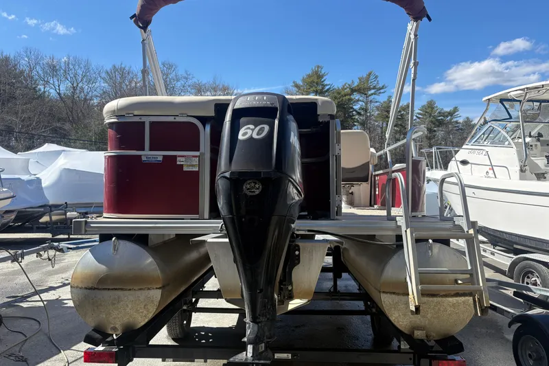 Slide: The Image of 2011 Sylvan 820 Mirage Cruise pontoon boat with 60 HP engine, docked outdoors. - 3
