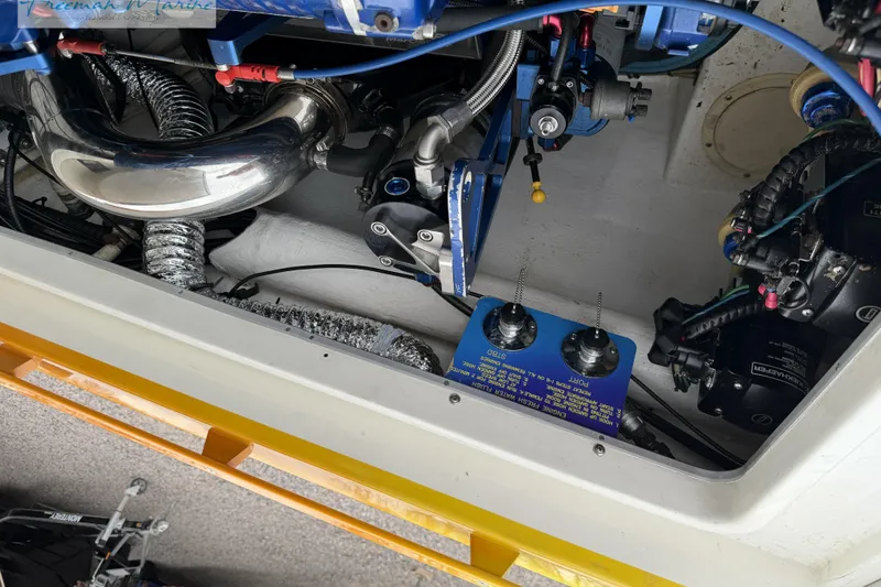 Slide: The Image of Engine compartment of a 2000 Cigarette 30' Mystique boat, showcasing mechanical components. - 26