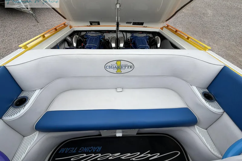 Slide: The Image of Interior view of a 2000 Cigarette 30' Mystique boat with engine compartment open. - 31