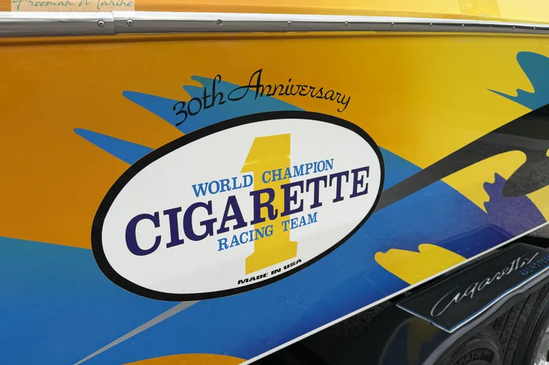Slide: The Image of 30th Anniversary Cigarette Racing Team logo on 2000 Cigarette 30' Mystique boat. - 4