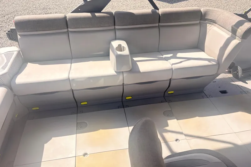 Slide: The Image of 2022 Sea Doo Switch interior seating with cup holder, showcasing modern design and comfort. - 13
