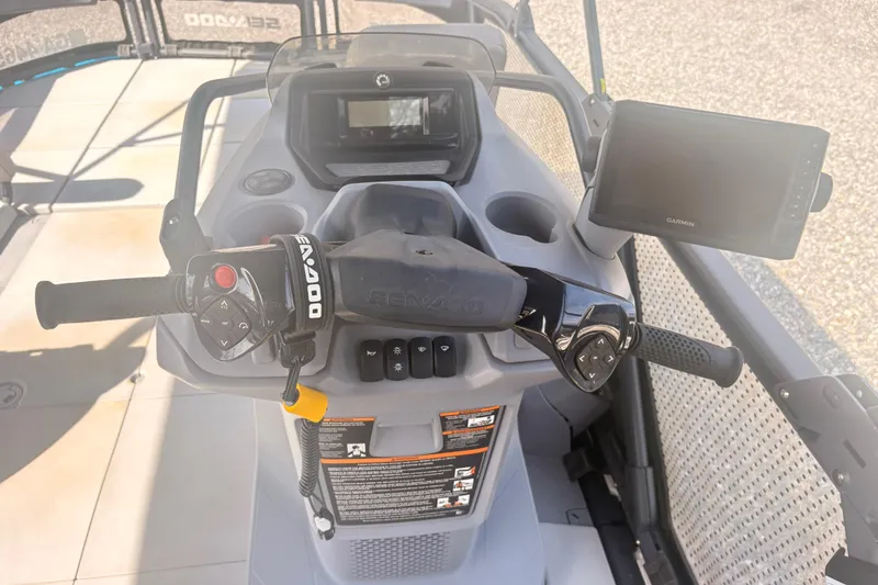 Slide: The Image of 2022 Sea Doo Switch dashboard with controls and Garmin display. - 14