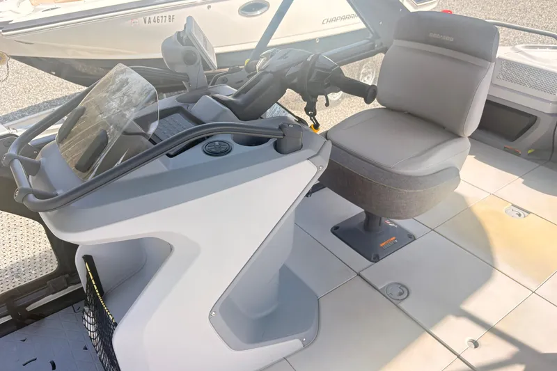 Slide: The Image of 2022 Sea Doo Switch interior with steering console and comfortable seating. - 6