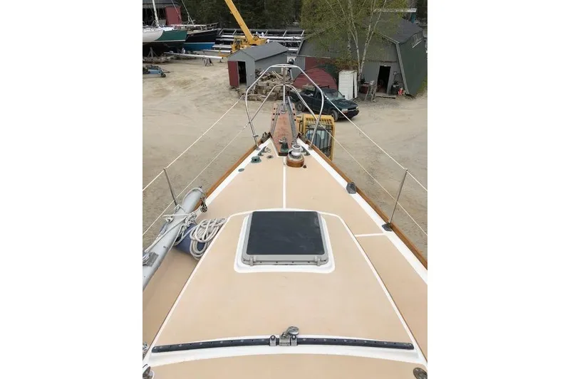 Slide: The Image of 1987 Cape Dory 36 sailboat deck view in a boatyard setting. - 15