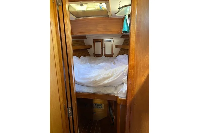 Slide: The Image of Cozy cabin interior of 1987 Cape Dory 36 sailboat with wooden finish. - 23