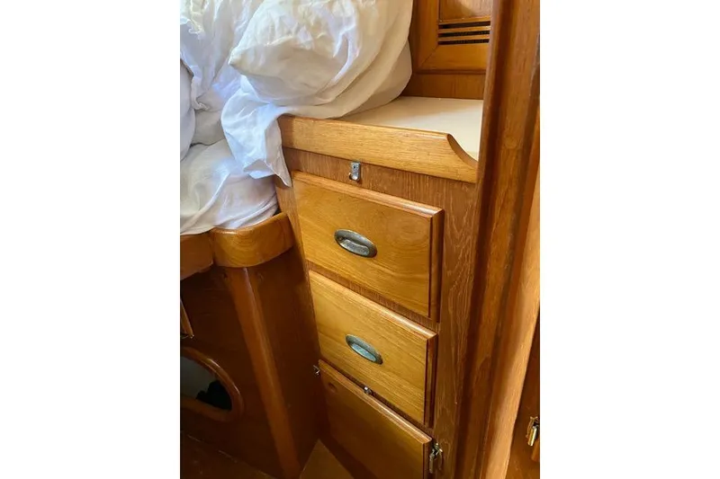 Slide: The Image of Wooden drawers in a 1987 Cape Dory 36 sailboat interior. - 27