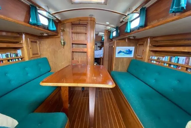 Slide: The Image of Interior of 1987 Cape Dory 36 sailboat with teal seating and wooden finishes. - 30