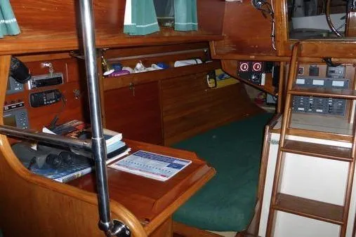 Slide: The Image of Interior of 1987 Cape Dory 36 sailboat with navigation station and wooden cabinetry. - 40