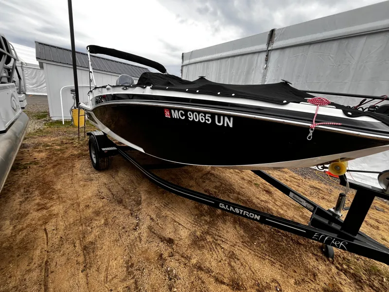 Slide: The Image of Black 2021 Glastron GTD 180 boat on trailer. - 4