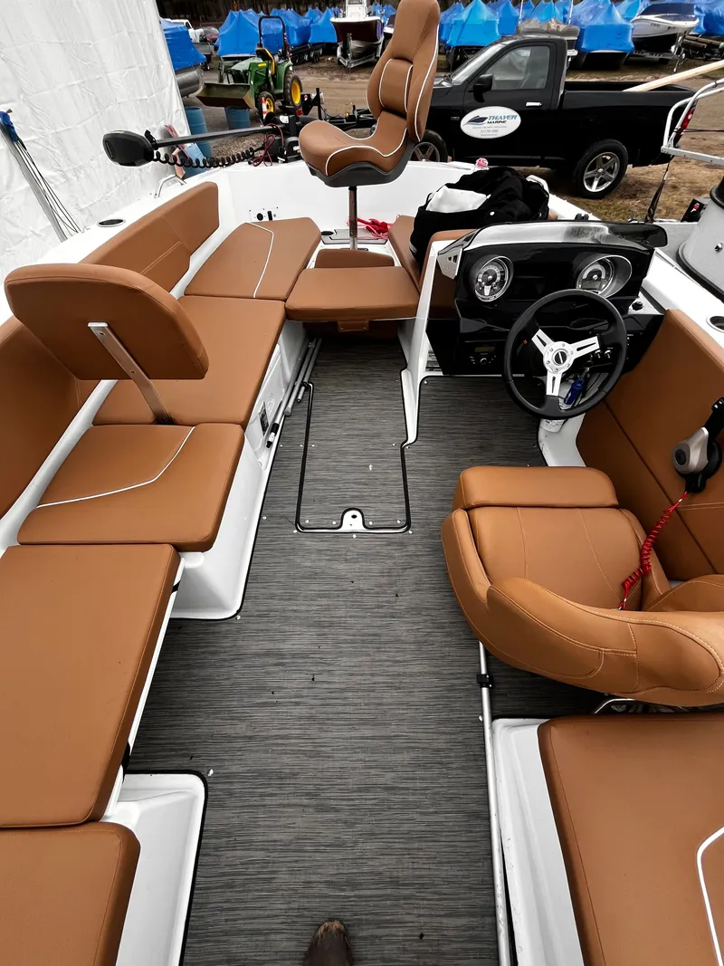 Slide: The Image of Interior view of a 2021 Glastron GTD 180 boat with brown seating. - 5