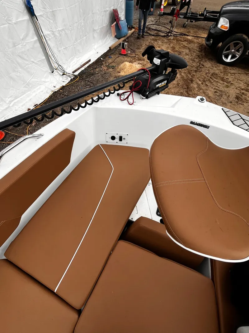 Slide: The Image of Interior of a 2021 Glastron GTD 180 boat with brown seats. - 6