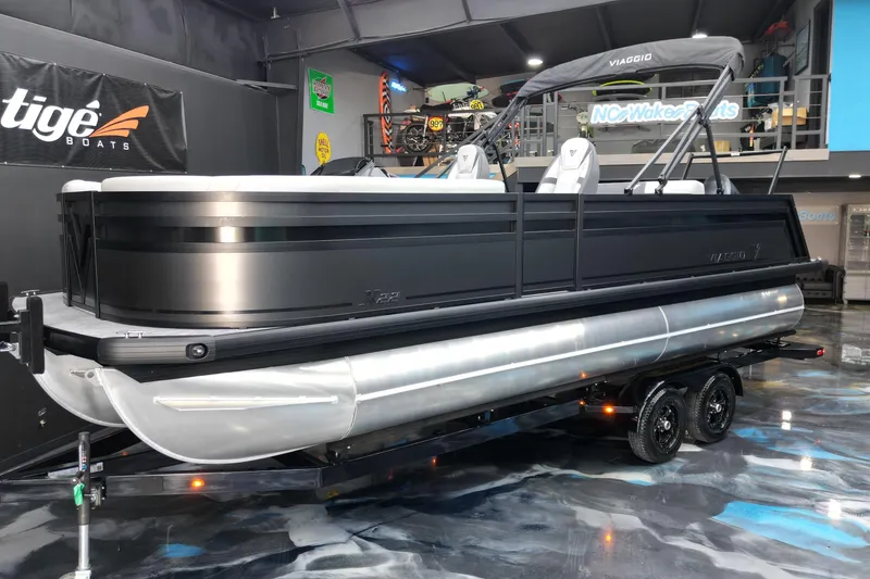 Slide: The Image of 2026 Viaggio Lago X-S 22 pontoon boat on trailer in showroom. - 20