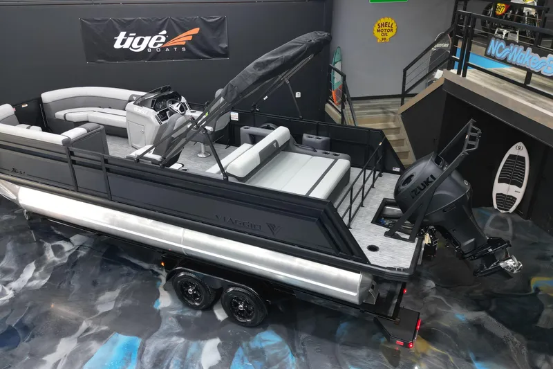 Slide: The Image of 2026 Viaggio Lago X-S 22 pontoon boat with Suzuki engine in showroom display. - 28