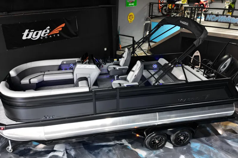 Slide: The Image of 2026 Viaggio Lago X-S 22 pontoon boat displayed indoors on a trailer. - 8