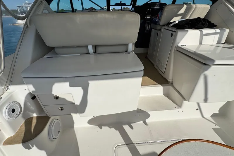 Slide: The Image of 2004 Tiara Yachts 3800 Open interior with seating and storage, showcasing luxury marine design. - 5