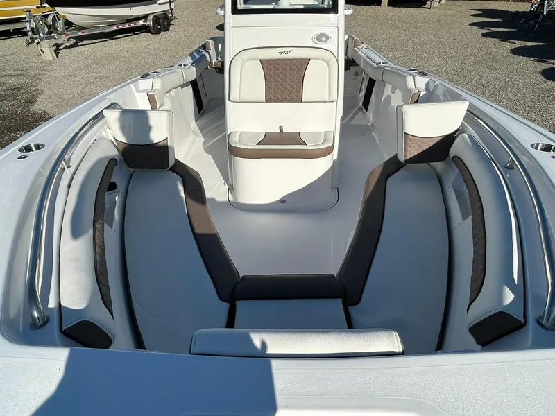 Slide: The Image of 2025 Tidewater 232 LXF boat interior with cushioned seating and modern design. - 10
