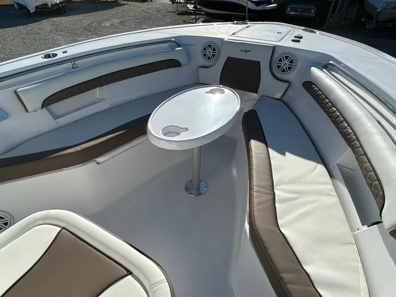 Slide: The Image of 2025 Tidewater 232 LXF boat interior with seating and table. - 11