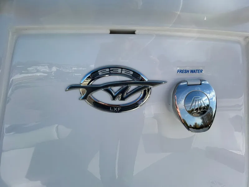 Slide: The Image of 2025 Tidewater 232 LXF boat emblem and fresh water access. - 24