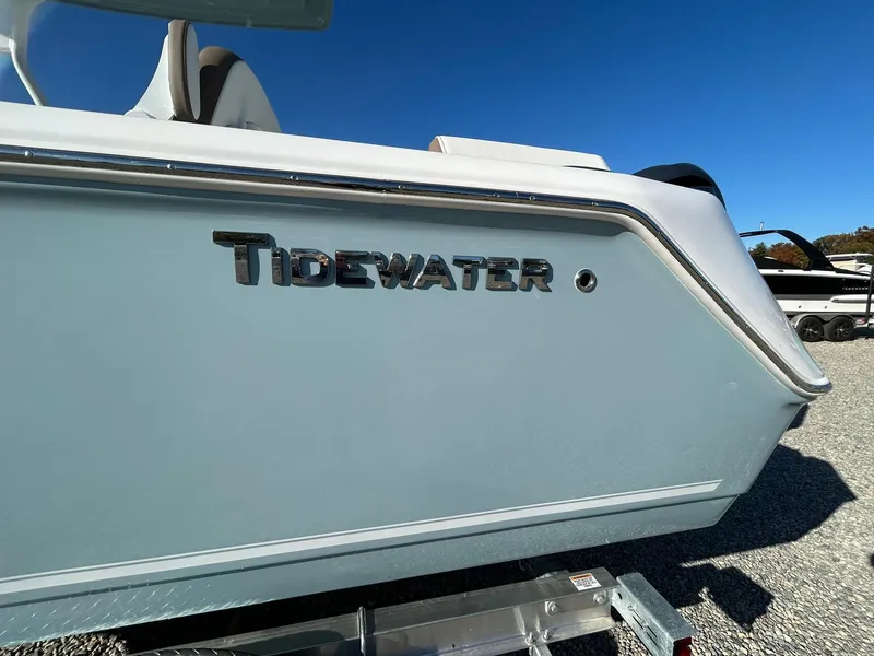 Slide: The Image of 2025 Tidewater 232 LXF boat side view with logo, on trailer. - 3