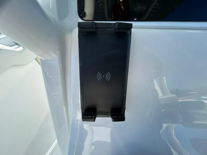 Slide: The Image of Tidewater 232 LXF 2025 boat with wireless charging pad on deck. - 31