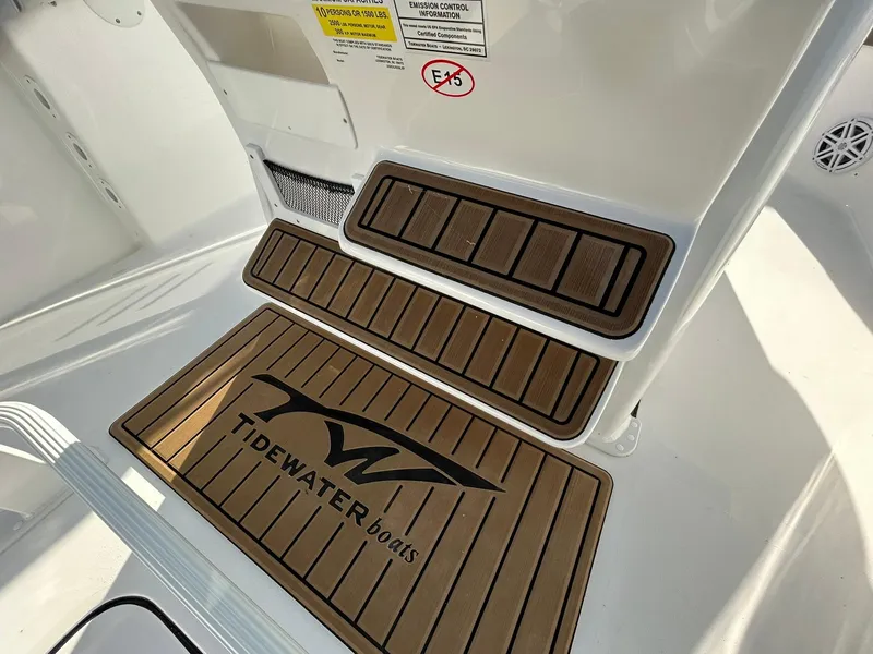 Slide: The Image of Tidewater 232 LXF 2025 boat interior with branded non-slip mats. - 32
