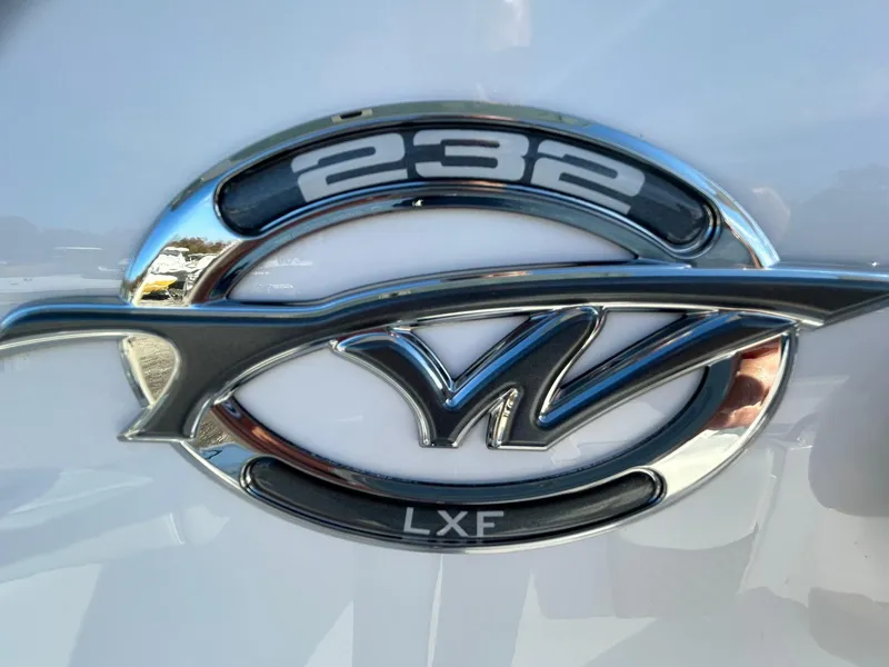 Slide: The Image of 2025 Tidewater 232 LXF boat emblem, chrome finish on white background. - 4