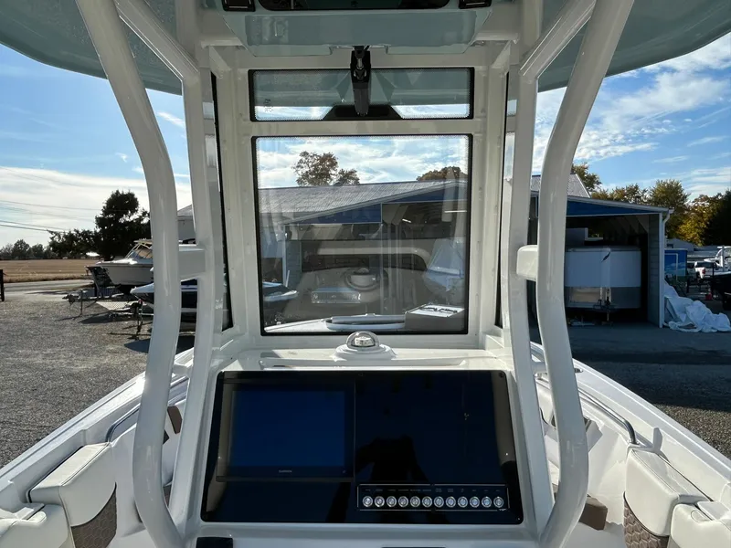 Slide: The Image of 2025 Tidewater 232 LXF boat console with modern navigation system and clear windshield. - 45