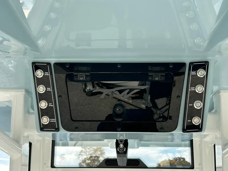 Slide: The Image of 2025 Tidewater 232 LXF boat dashboard with control panel and switches. - 46