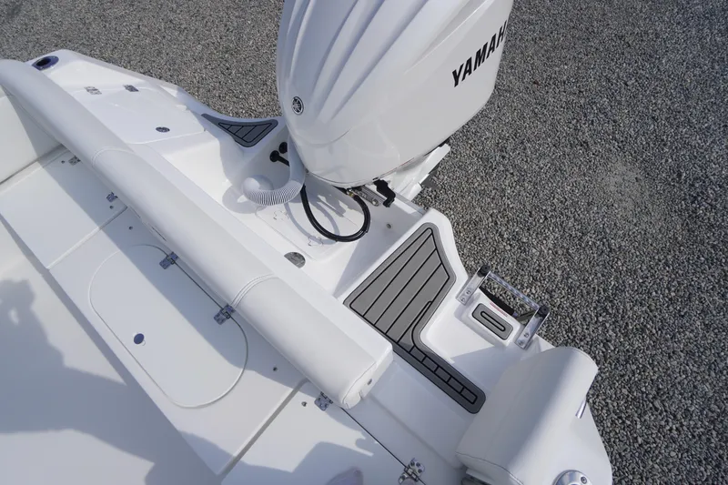 Slide: The Image of 2026 Tidewater 232 LXF boat with Yamaha engine, featuring sleek white design and modern fittings. - 66