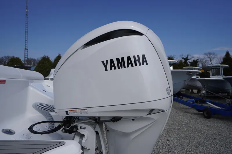 Slide: The Image of 2026 Tidewater 232 LXF boat with Yamaha outboard motor in a marina setting. - 67