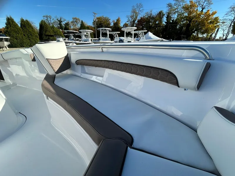 Slide: The Image of 2025 Tidewater 232 LXF boat interior with sleek seating and modern design. - 9