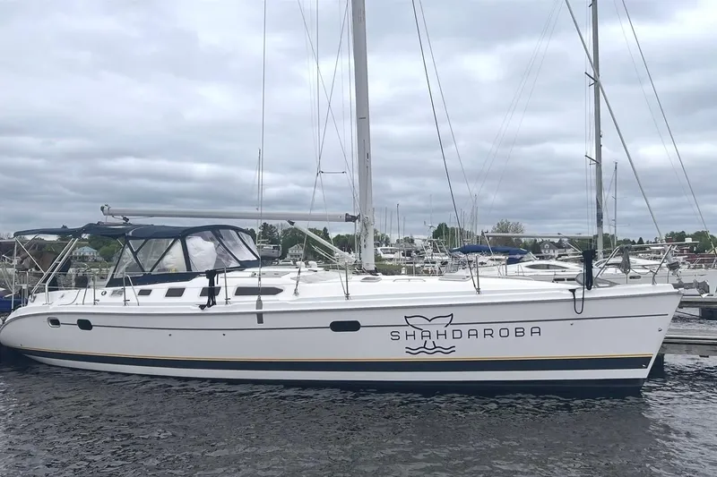 The Image of 2002 Hunter 466 sailboat docked, cloudy sky. - 0