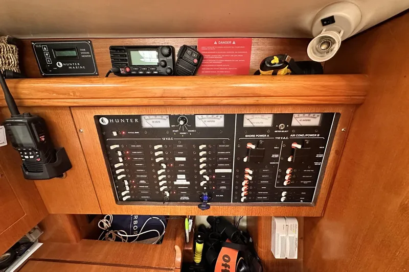 Slide: The Image of Electrical control panel of a 2002 Hunter 466 yacht with communication devices. - 29