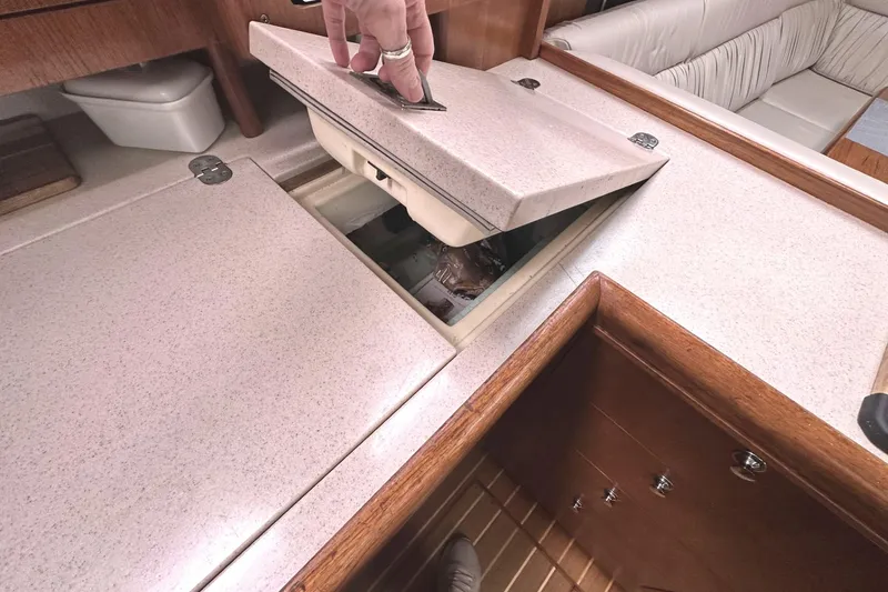 Slide: The Image of Interior of a Hunter 466 yacht with open cooler compartment. - 39