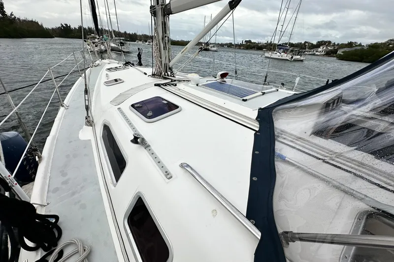 Slide: The Image of Sailboat deck view, Hunter 466 model, 2002, anchored in a scenic harbor. - 4
