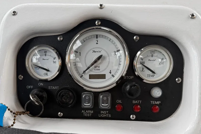 Slide: The Image of Instrument panel of a 2002 Hunter 466 boat with gauges and controls. - 50